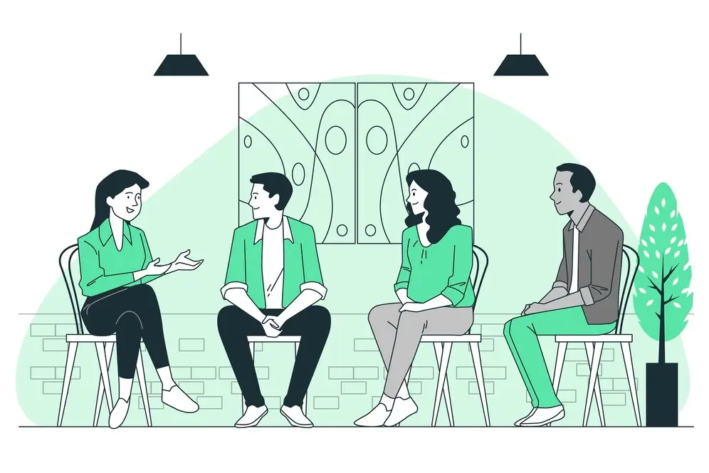 Ilustração mostrando quatro pessoas sentadas conversando. A inteligência emocional é fundamental para a construção de interações saudáveis.