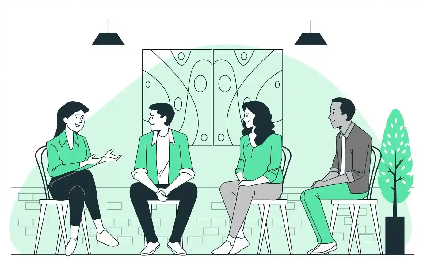 Ilustração mostrando quatro pessoas sentadas conversando. A inteligência emocional é fundamental para a construção de interações saudáveis.